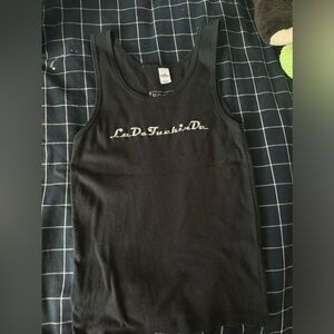 Y2k black tank top, print says “La De Fucking Da”